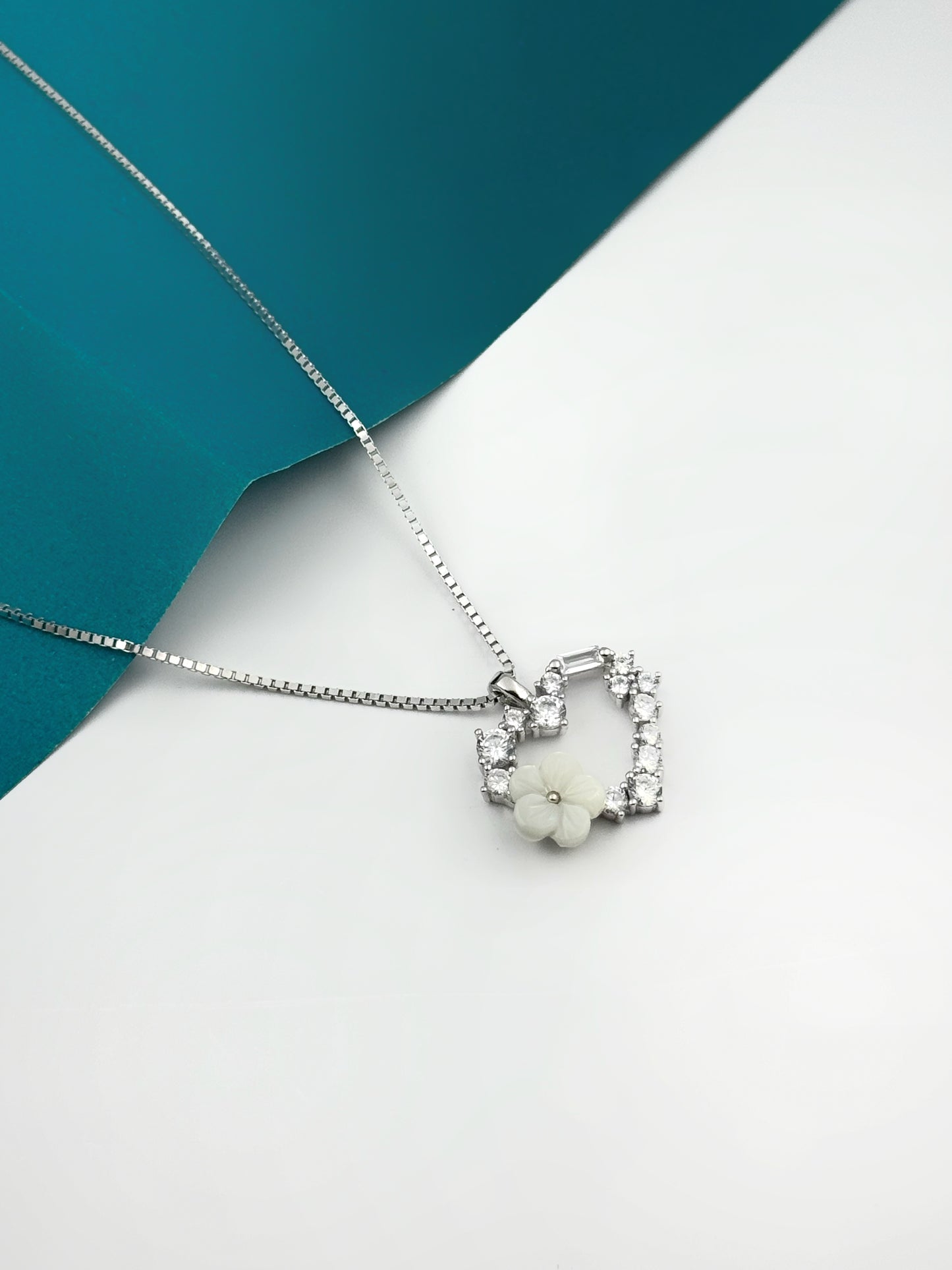 Heart pendant with flower.